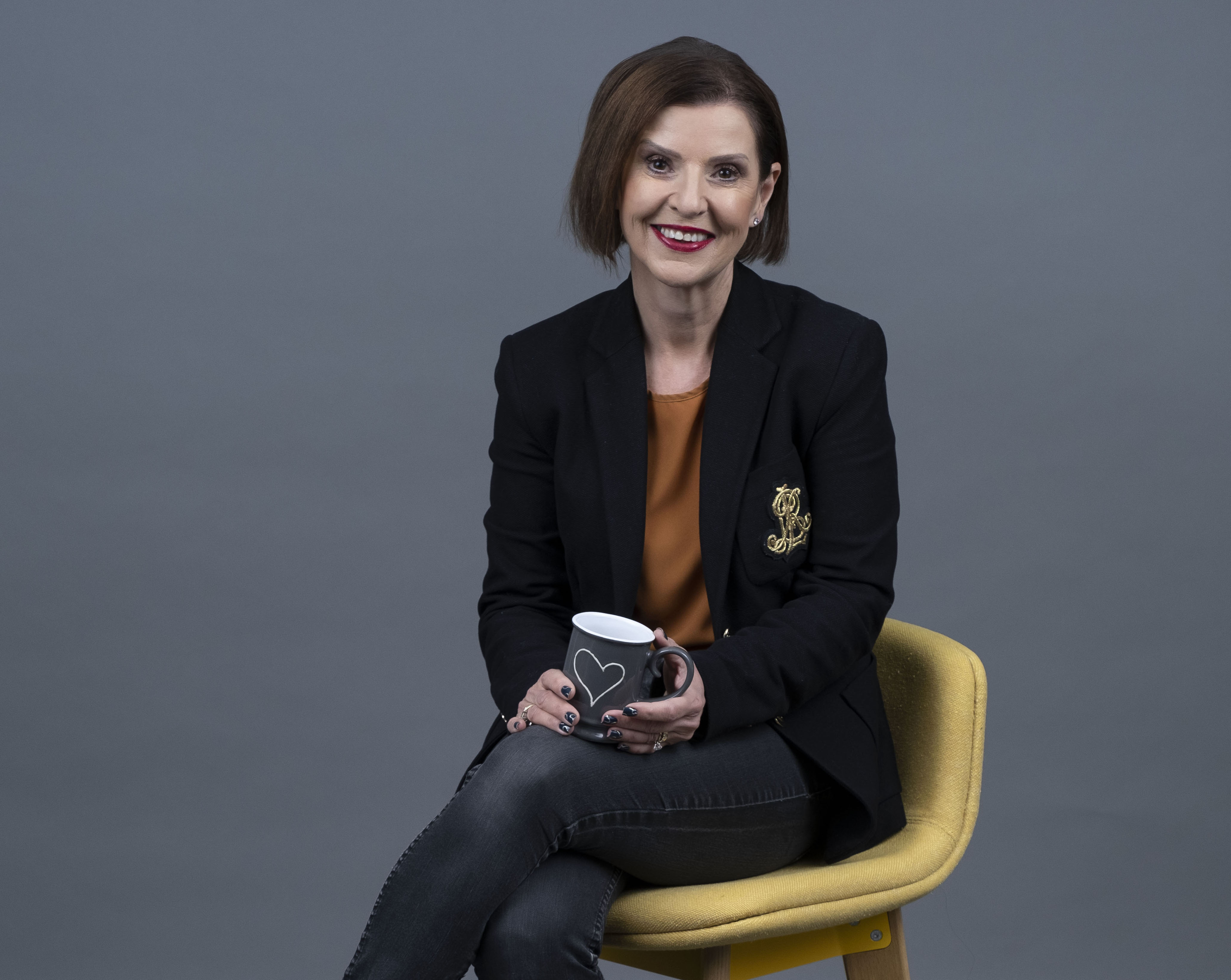 employee sitting down with a coffee